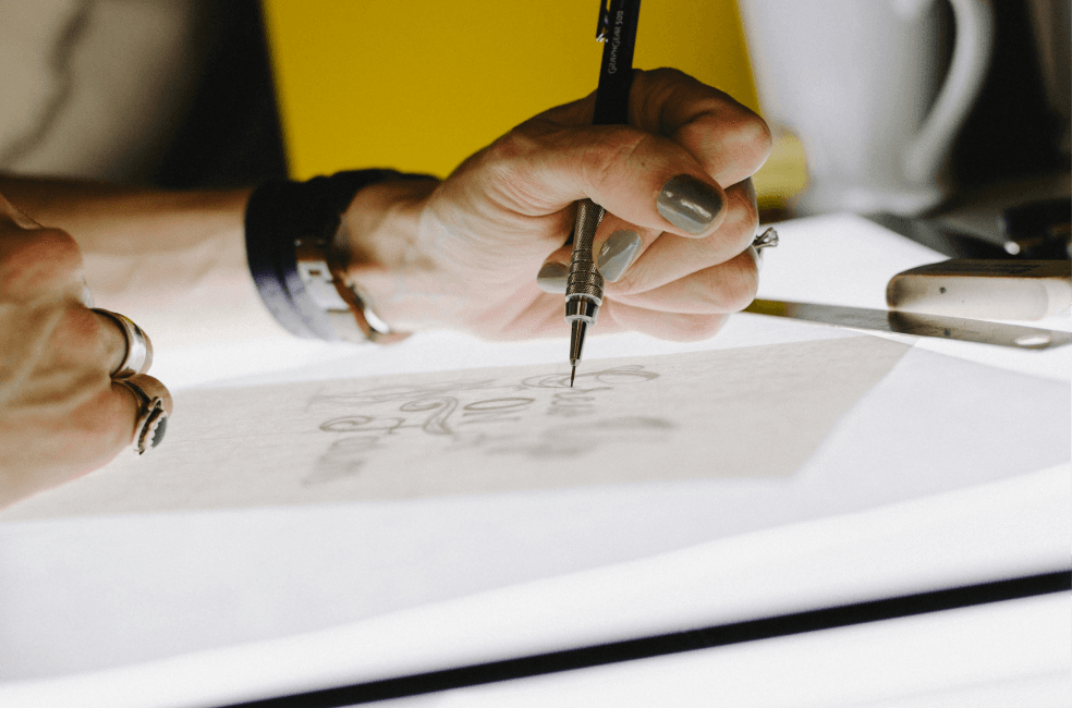 Designer sketching custom jewellery design.