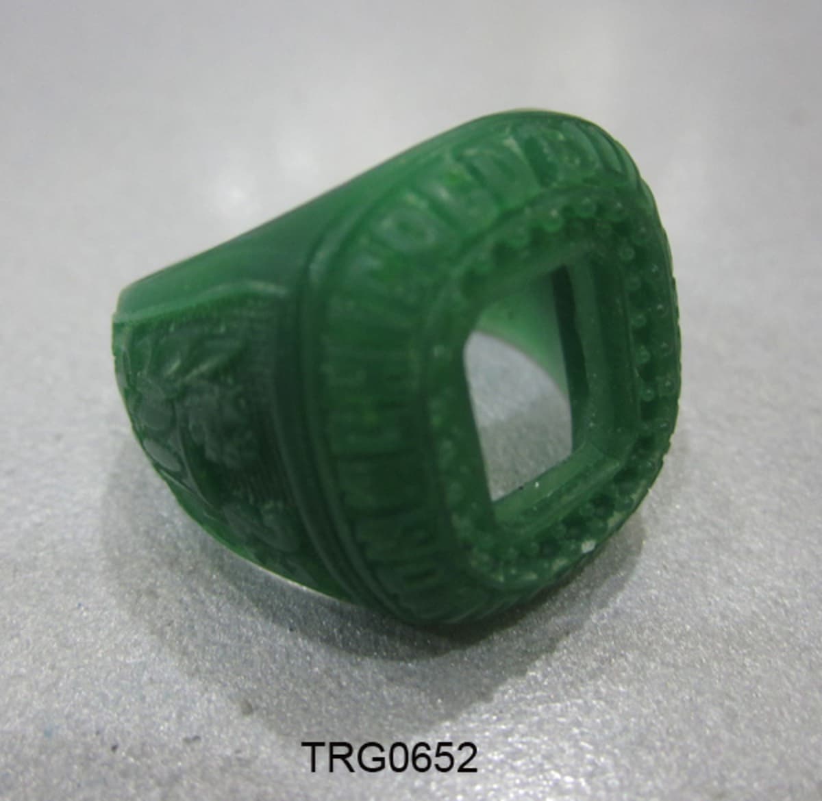 Green wax master of a carved gem ring before casting.